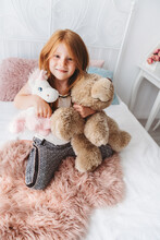 Cute Girl With Her Favorite Plush Toys