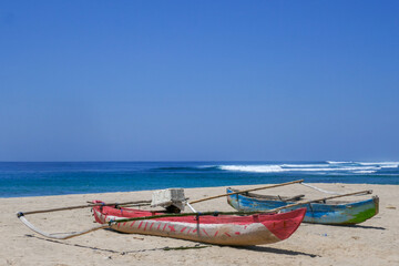 Poster - Colorful outrigger fishing boats on Wanokaka beach, Lamboya, Sumba island, East Nusa Tenggara, Indonesia 