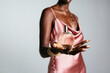 © BONNINSTUDIO/Stocksy - Anonymous African American woman showing perfume