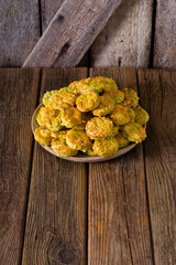 Canvas Print - homemade baked scone cakes from fresh ramson leaves and cheese, old wooden texture