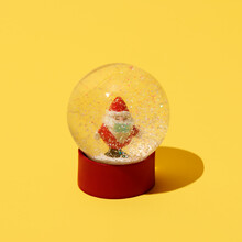 Santa Claus In A Snow Globe Wearing Mask
