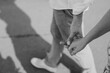 © Melissa Milis Photography/Stocksy - monochrome close up of young couple walking holding hands