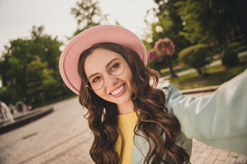 Poster - Portrait of pretty positive young person take selfie toothy smile enjoy free time walking park outdoors