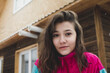 © Laika One/Stocksy - Portrait Of Young Woman Wearing Vintage Style Tracksuit