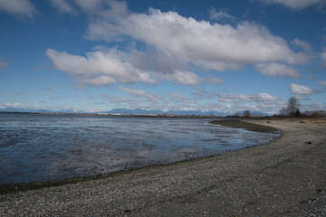 A picture of sand beach at low tide.   Tsawwassen BC Canada    
