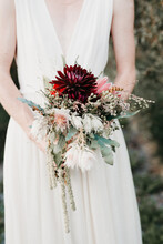 Bride Holding A Beautiful Wedding Bouquet With White And Red Details