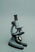 Small Microscope On A Blue Background