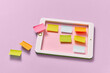 © Yaroslav Danylchenko/Stocksy - Colorful paper note sheets on a craft tablet screen.