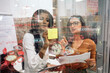 © Nunez Image/Stocksy - Office Workers Using Board