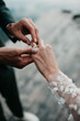 © Melissa Milis Photography/Stocksy - groom ringing bride with golden diamond ring