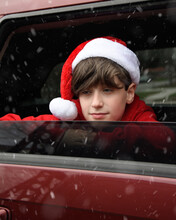 Christmas Boy Looking Outside Car Window