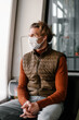 © Alina Hvostikova/Stocksy - Man in mask riding modern vehicle