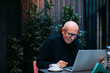 © Studio Firma/Stocksy - A Businessman in a Cafe