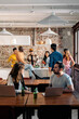 © Nunez Image/Stocksy - Colleagues Having Snack in Coworking