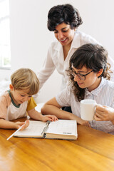 Wall Mural - Female couple with son studying