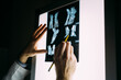 © Vradiy Art/Stocksy - Doctor examining an X-Ray