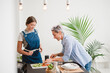 © Studio Marmellata/Stocksy - Women cooking healthy meal in kitchen