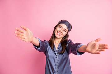 Wall Mural - Photo portrait of pretty girl inviting to hug isolated on pastel pink colored background