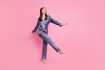 Wall Mural - Photo portrait full body view of gorgeous woman dancing isolated on pastel pink colored background