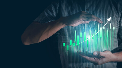 Wall Mural - Businessman hand show Stock chart showing rising stock sign with graph indicator. Interest rate financial and mortgage rates concept.