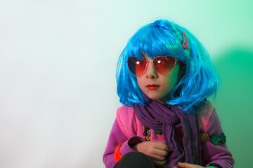 Portrait of a glamour child wearing blue wig