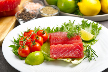 Wall Mural - tuna sushi, Tuna carpaccio, tuna sashimi with vegetables. healthy eating with seafood, we cook at home