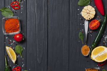 Wall Mural - Spices and herbs over wooden background, healthy or cooking concept.