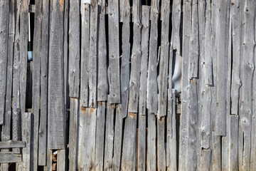 Poster - an old wooden wall of planks. dilapidated housing