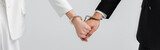 Fototapeta  - Cropped view of newlyweds holding hands in handcuffs isolated on grey, banner