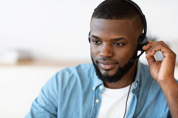 Wall Mural - Closeup Portrait Of Handsome Black Male Hotline Operator In Headset