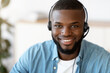 Hotline Support Service. Portrait Of Smiling African Customer Service Operator In Headset