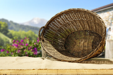 Wall Mural - Brown old basket on table and summer time. 