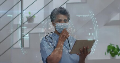 Sticker - Animation of scope scanning and covid 19 cell over senior female doctor in face mask using tablet