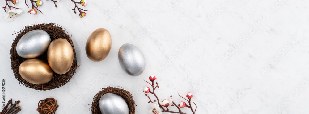 Design concept of Golden and silver Easter eggs in the nest with white plum flower. - obrazy, fototapety, plakaty 