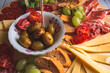 Italian food - wooden board of italian snacks