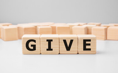 Poster - Word GIVE made with wood building blocks
