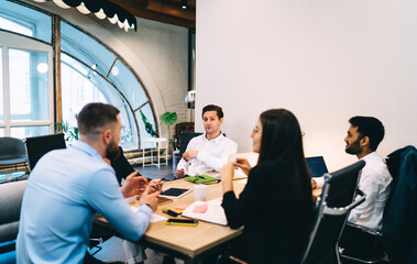 Wall Mural - Group of business partners discussing project in office