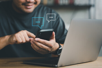 Poster - Man hand using smartphone typing Live chat chatting and social network concepts, chatting conversation working at home in chat box icons pop up. Social media marketing technology concept.