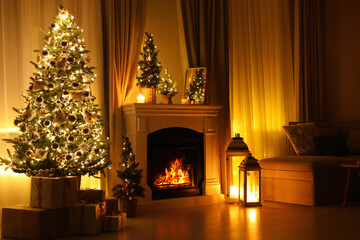 Canvas Print - Stylish living room interior with beautiful fireplace, Christmas tree and other decorations at night