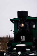 Green Steam Locomotive On A Railway Monument.