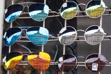 Sunglasses market  on the Amsterdam streets - buildings reflection in sunglasses