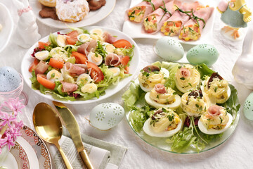 Wall Mural - Easter breakfast with fresh salad and stuffed eggs with mayonnaise