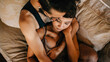 © Connect Images - Loving couple relaxing on sofa