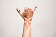 © Connect Images - Hand with henna tattoo making gesture
