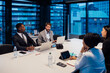 © Connect Images - Businessmen and women having discussion during conference table meeting