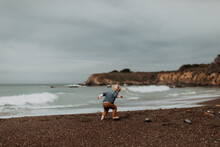 Toddler Playing On Beach, Morro Bay, California, United States
