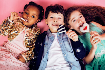 lifestyle people concept: diverse nation children playing together, boy and girl, caucasian and african american