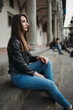 © Connect Images - Woman daydreaming on steps