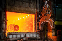  Heat Treated Red Hot Steel Ingot Being Lifted By Crane In Furnace In Steelworks