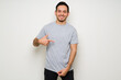 © AntonioDiaz - Happy hispanic man in a gray template t-shirt
